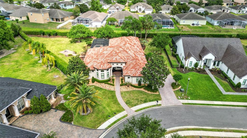 6538 Eagle View Loop Lakeland, FL 33813 - Photo 85 of 89 an aerial view of a house with a garden and lake view