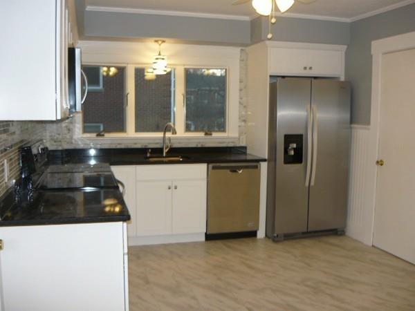 30 Pitman Road Swampscott, MA 01907 - Photo 13 of 31 a kitchen with granite countertop a sink a stove and refrigerator
