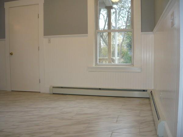 30 Pitman Road Swampscott, MA 01907 - Photo 15 of 31 an empty room with wooden floor and windows