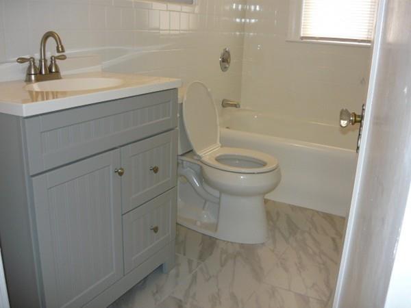 30 Pitman Road Swampscott, MA 01907 - Photo 17 of 31 a bathroom with a toilet sink and a bathtub