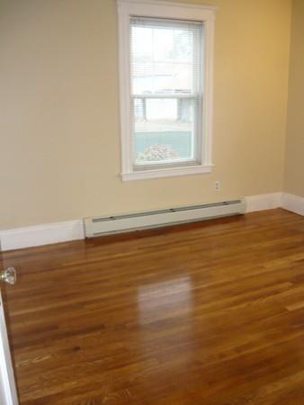 30 Pitman Road Swampscott, MA 01907 - Photo 24 of 31 an empty room with wooden floor and windows