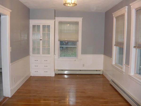 30 Pitman Road Swampscott, MA 01907 - Photo 10 of 31 an empty room with wooden floor and windows