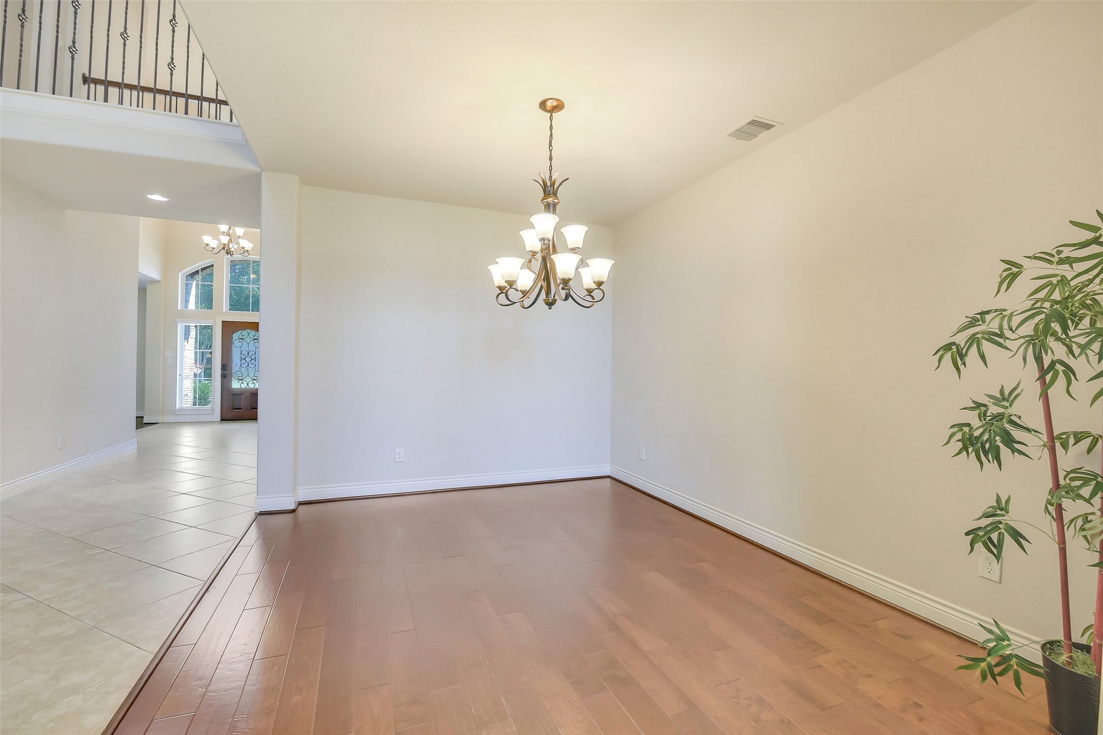 27906 Colonial Point Drive Katy, TX 77494 - Photo 13 of 39 a view of a room with wooden floor and chandelier