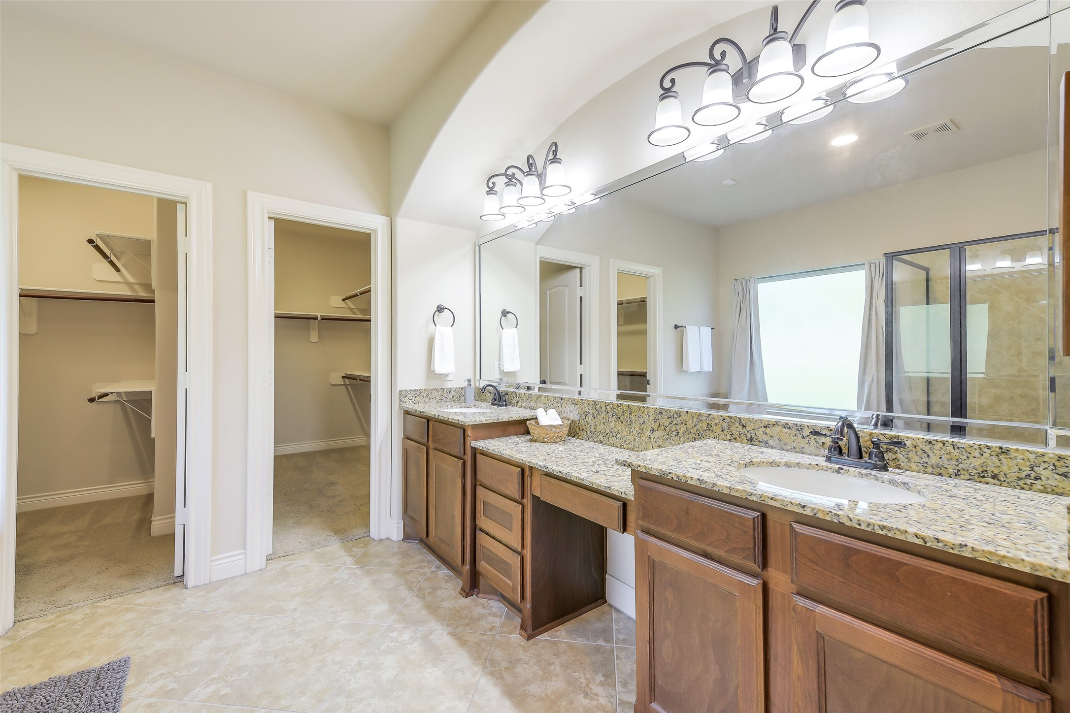 27906 Colonial Point Drive Katy, TX 77494 - Photo 22 of 39 a bathroom with a granite countertop sink a large mirror and a shower
