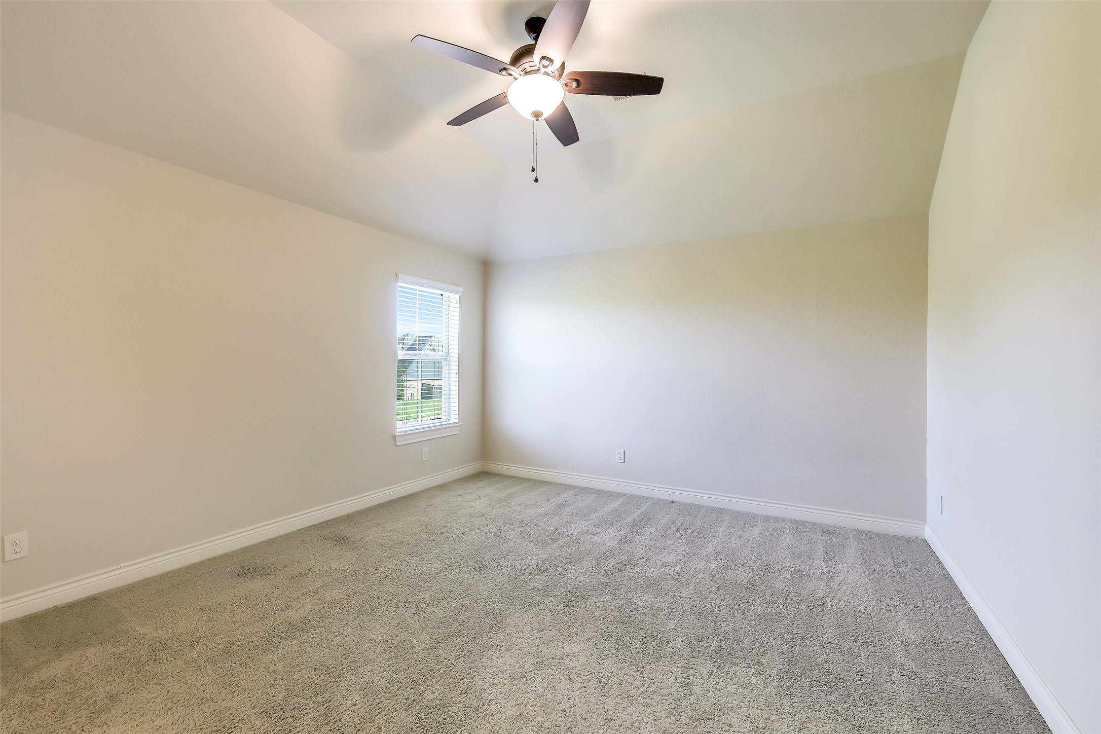 27906 Colonial Point Drive Katy, TX 77494 - Photo 33 of 39 an empty room with a window and a fan