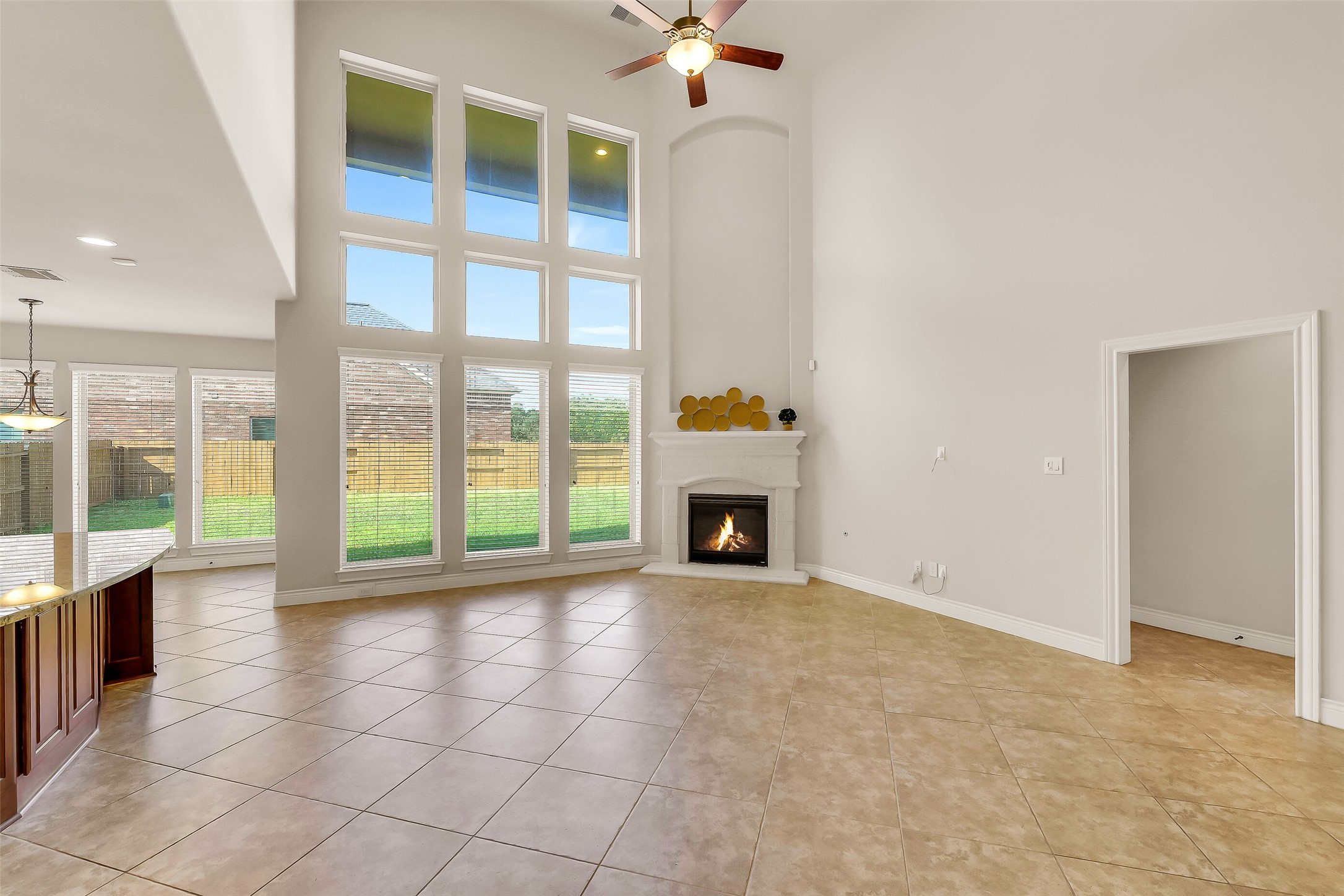 27906 Colonial Point Drive Katy, TX 77494 - Photo 5 of 39 a view of an empty room with a fireplace and a large window