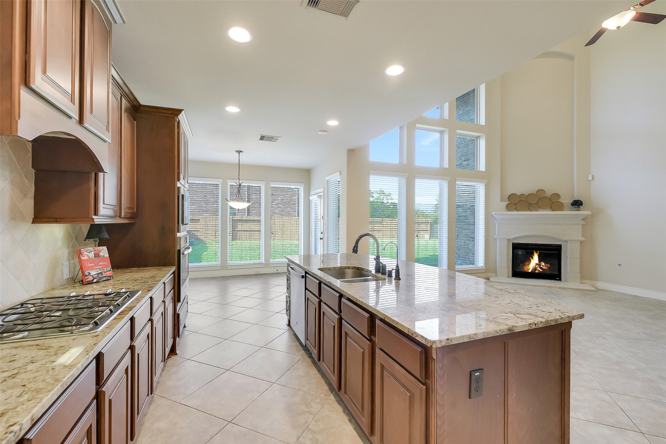 27906 Colonial Point Drive Katy, TX 77494 - Photo 9 of 39 a large kitchen with granite countertop a sink and a stove