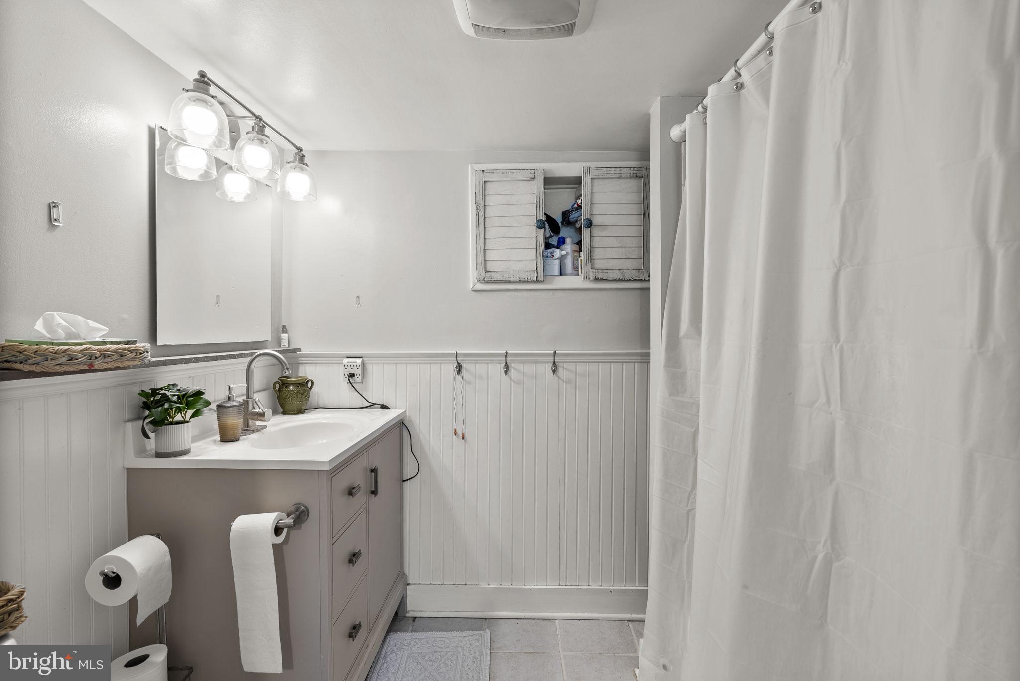 12625 Harford Road Kingsville, MD 21087 - Photo 11 of 33 a bathroom with a sink mirror and vanity