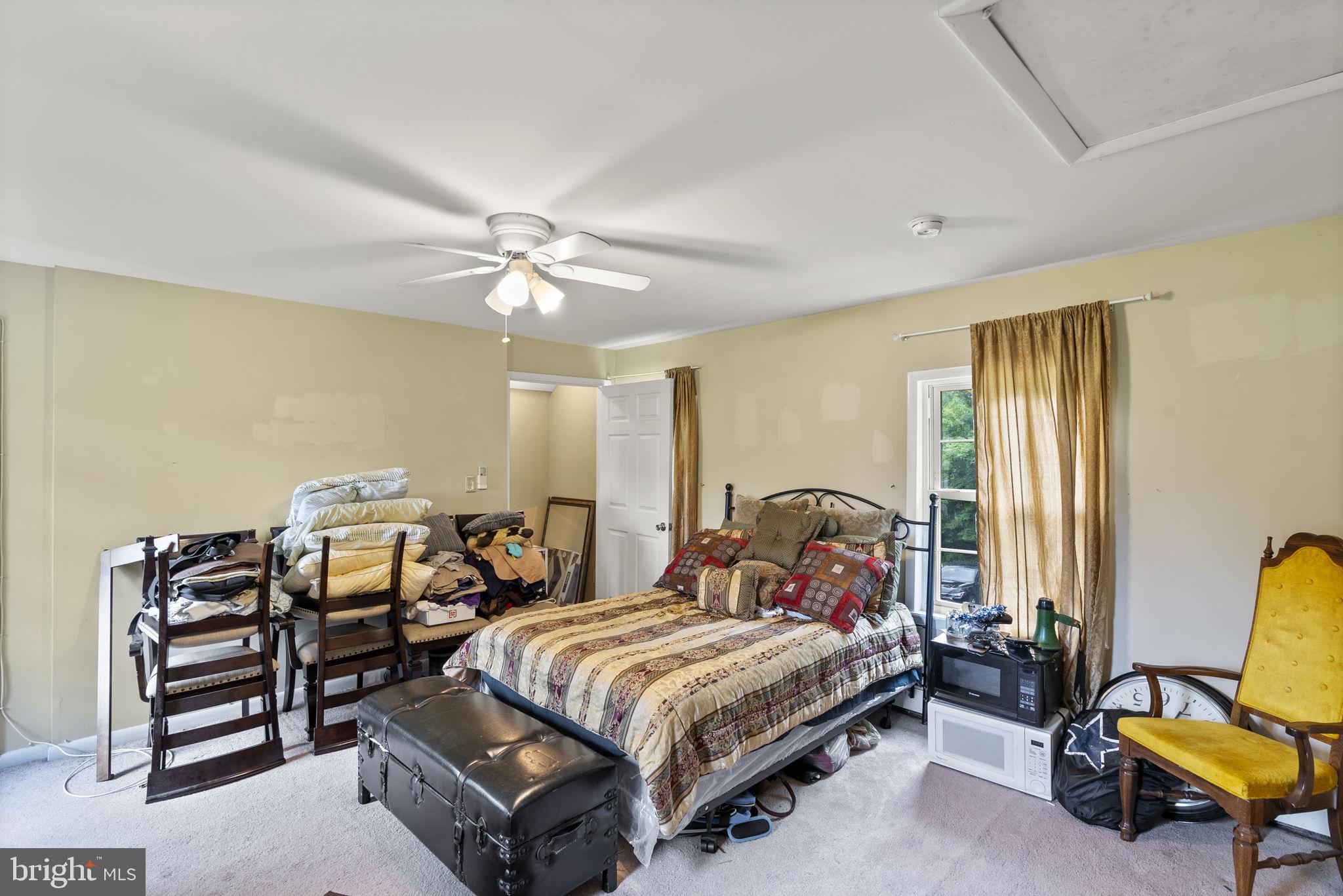 12625 Harford Road Kingsville, MD 21087 - Photo 19 of 33 a bedroom with a bed and a chandelier