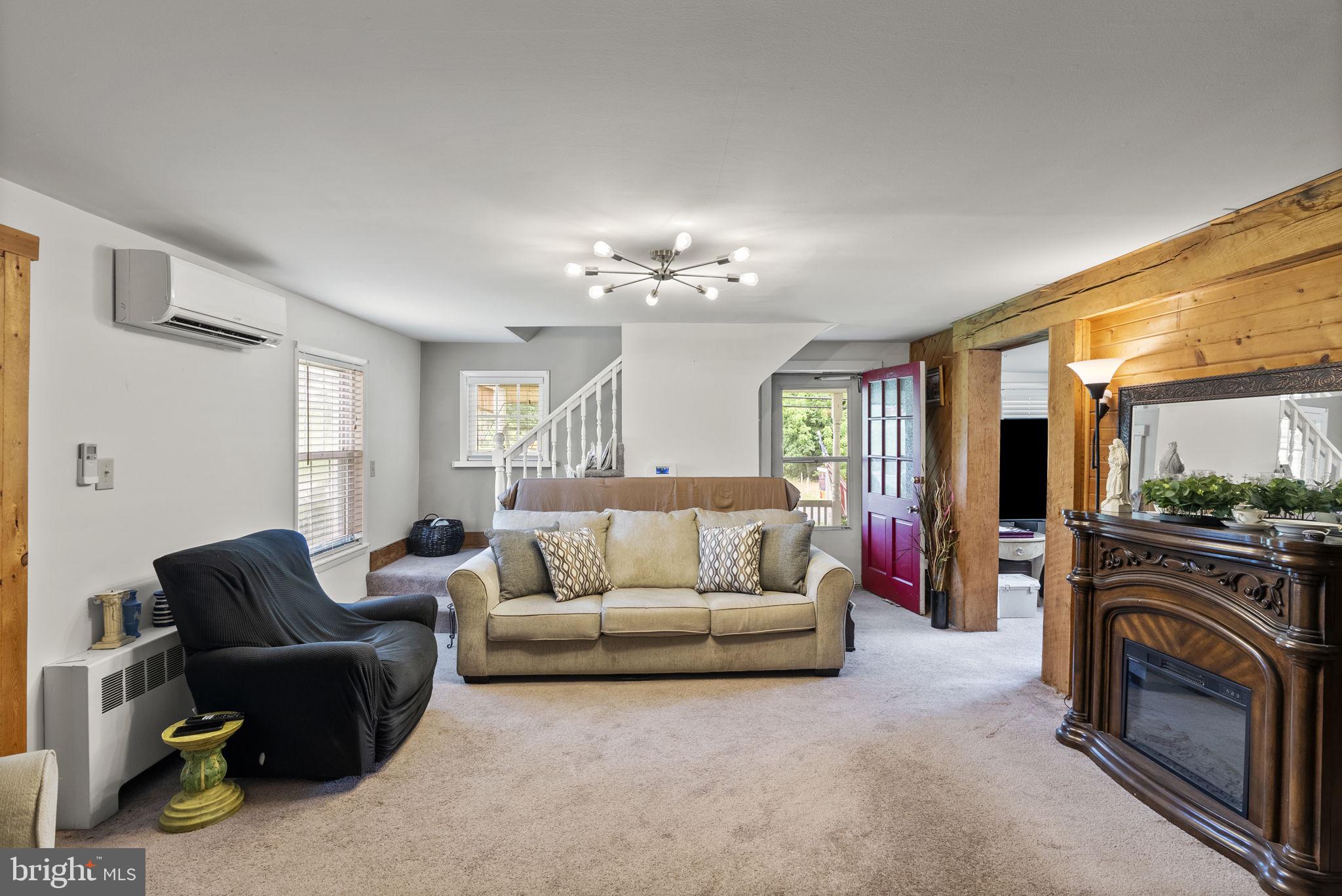 12625 Harford Road Kingsville, MD 21087 - Photo 21 of 33 a living room with furniture and a fireplace