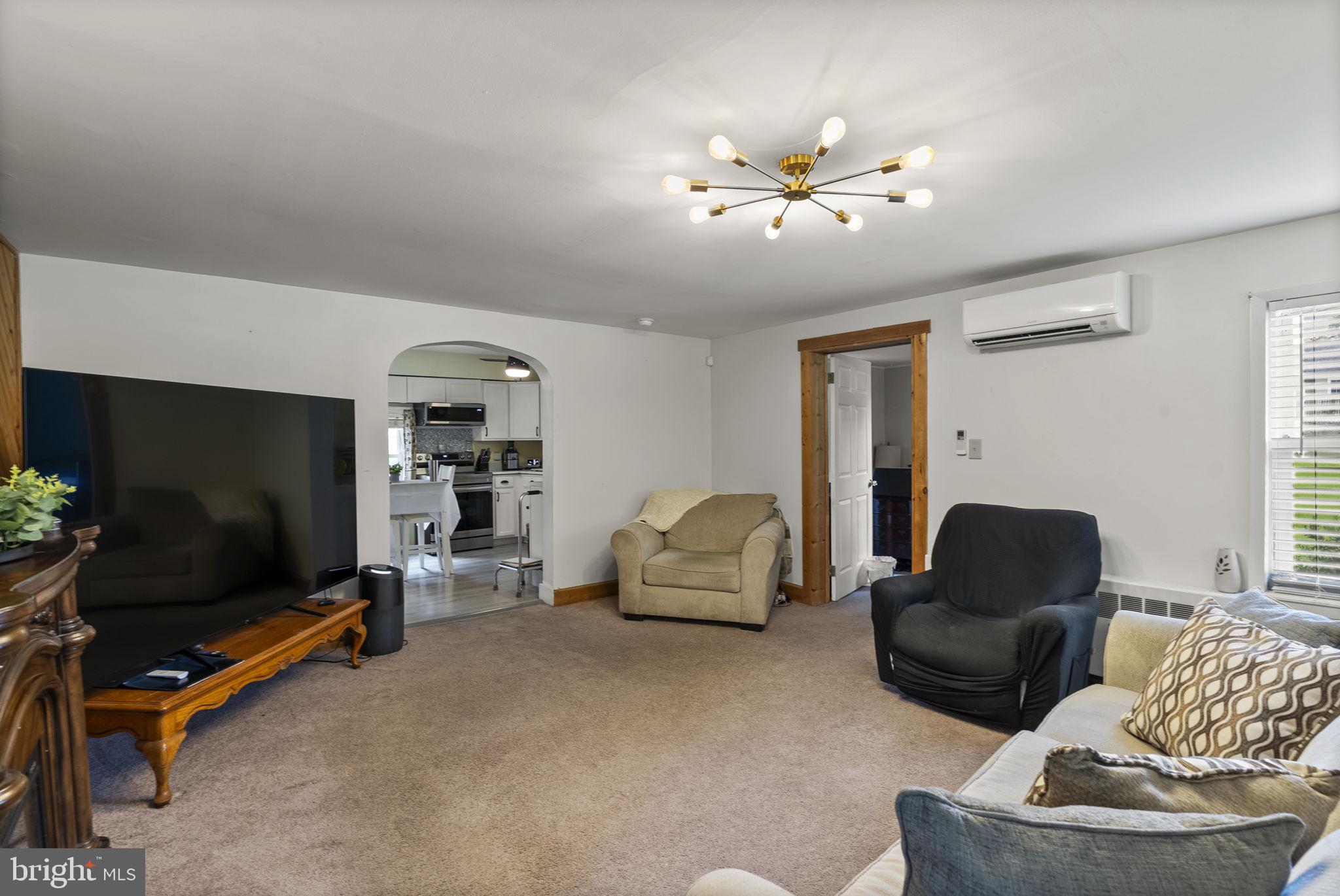 12625 Harford Road Kingsville, MD 21087 - Photo 23 of 33 a living room with furniture and a flat screen tv