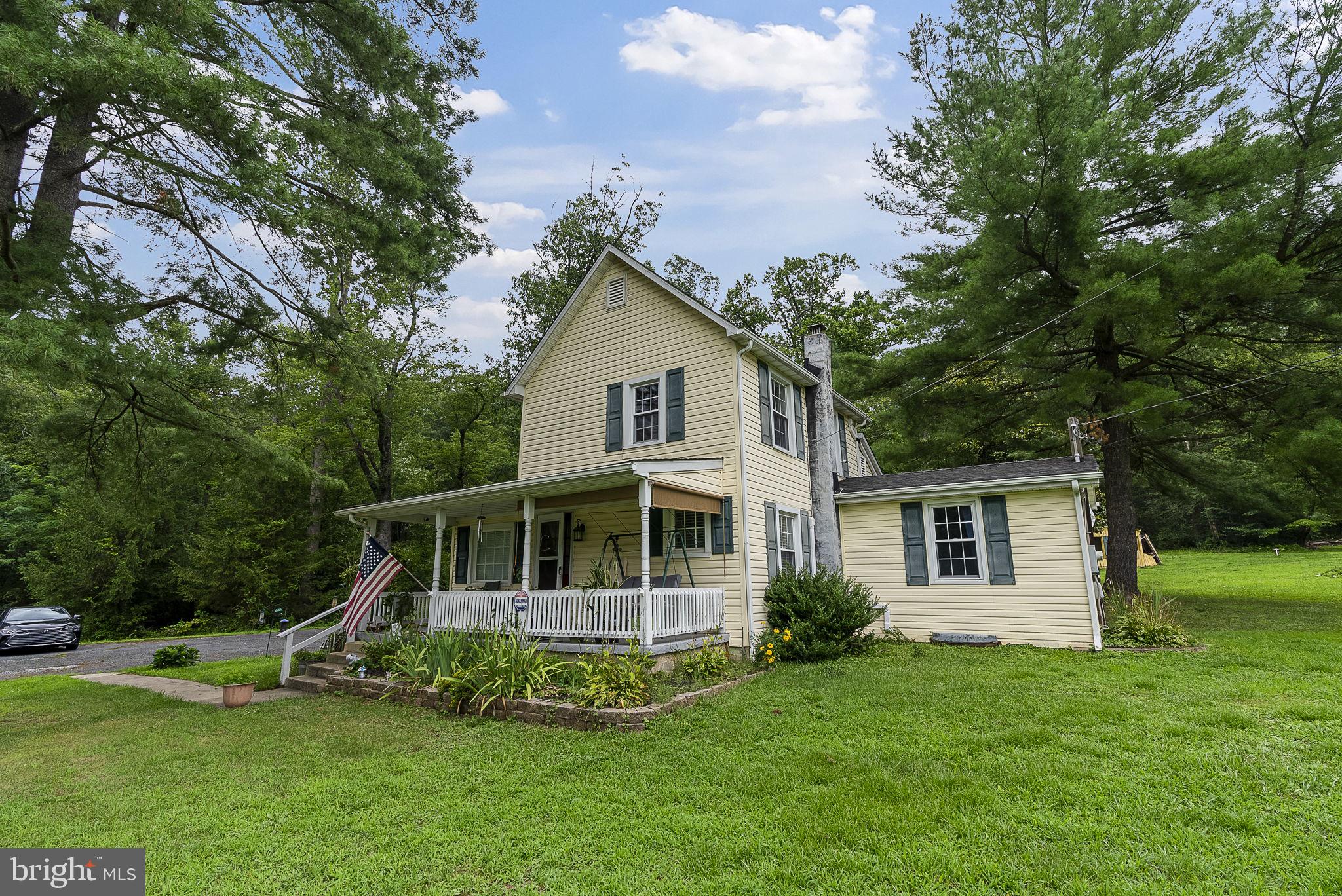 12625 Harford Road Kingsville, MD 21087 - Photo 28 of 33 a view of a house with a yard deck and a large tree