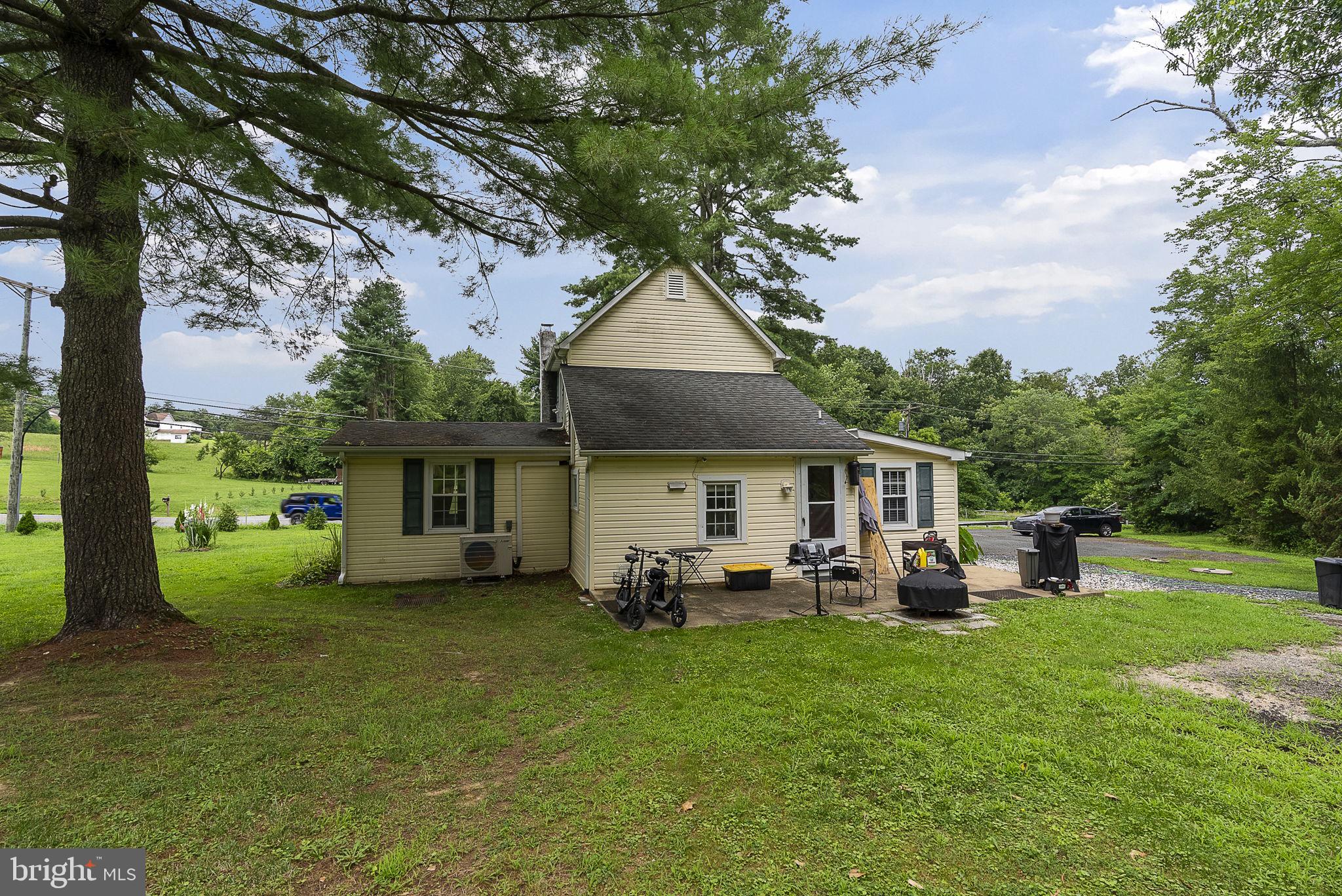 12625 Harford Road Kingsville, MD 21087 - Photo 31 of 33 a view of a house with backyard sitting area and garden
