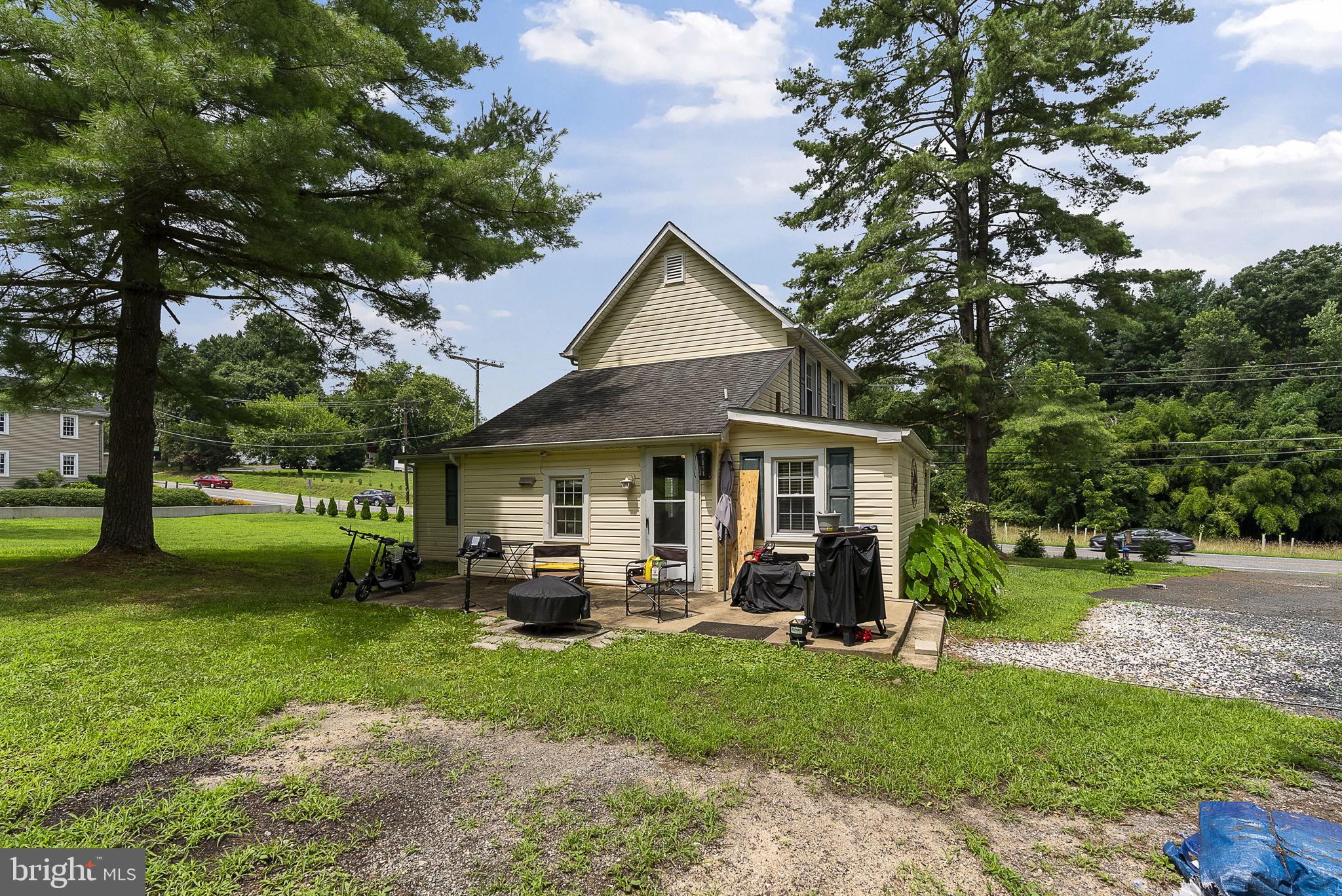 12625 Harford Road Kingsville, MD 21087 - Photo 32 of 33 a front view of a house with a garden and trees