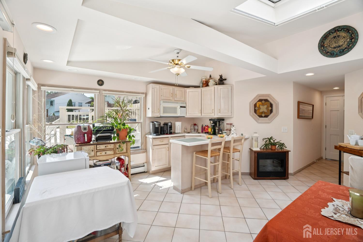 266 Amherst Avenue Colonia, NJ 07067 - Photo 16 of 22 a living room with furniture and kitchen view