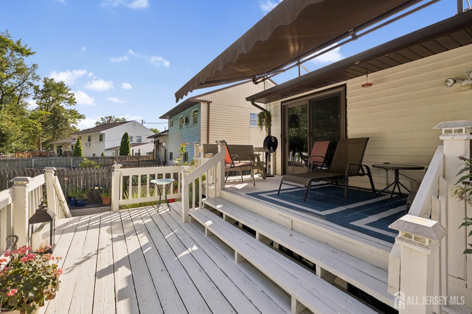 266 Amherst Avenue Colonia, NJ 07067 - Photo 21 of 22 a view of a balcony with chairs and wooden floor