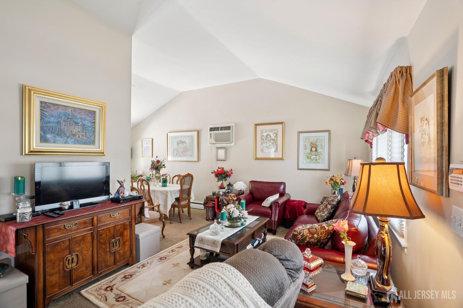 266 Amherst Avenue Colonia, NJ 07067 - Photo 3 of 22 a living room with furniture and a flat screen tv
