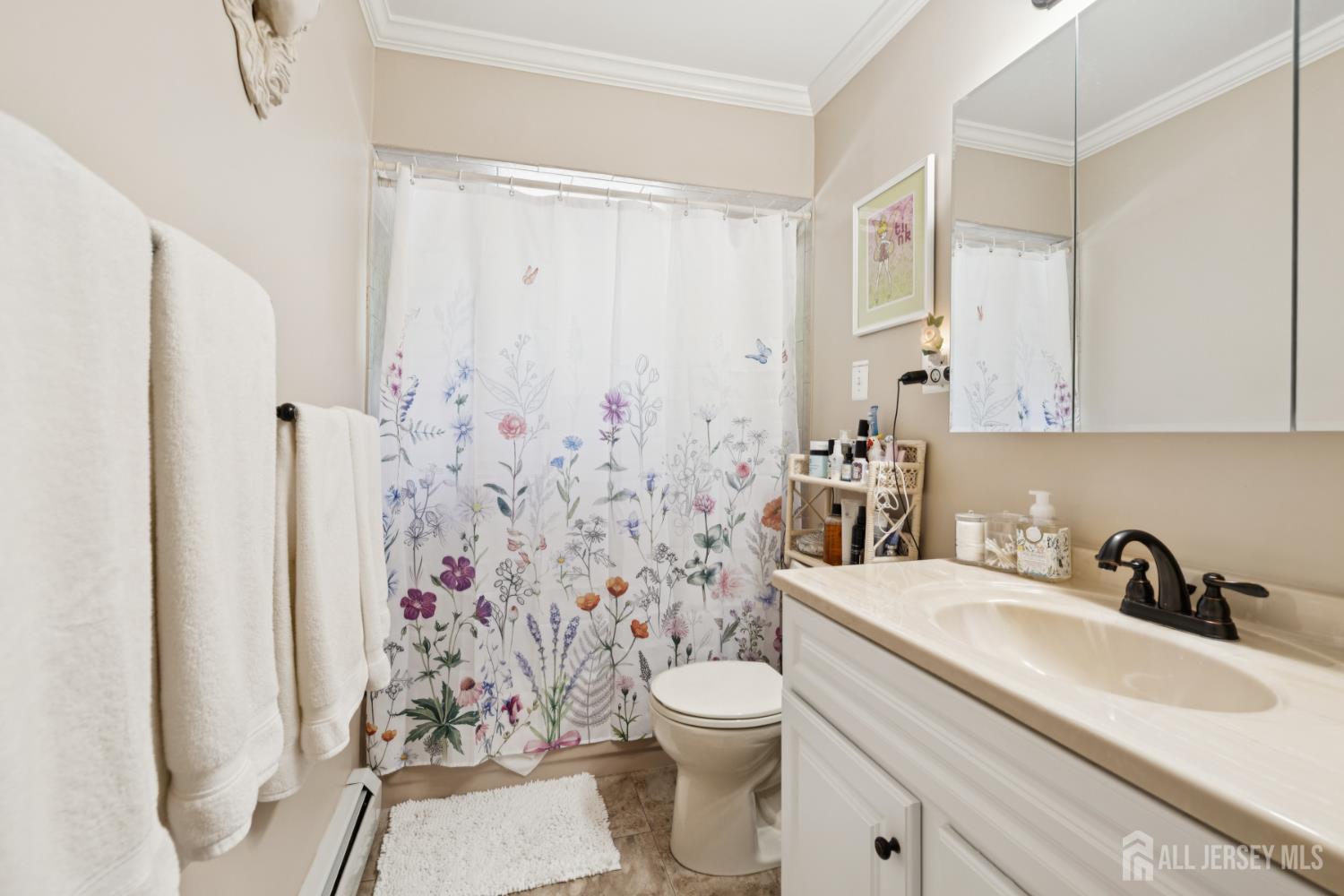 266 Amherst Avenue Colonia, NJ 07067 - Photo 7 of 22 a bathroom with a sink toilet and shower
