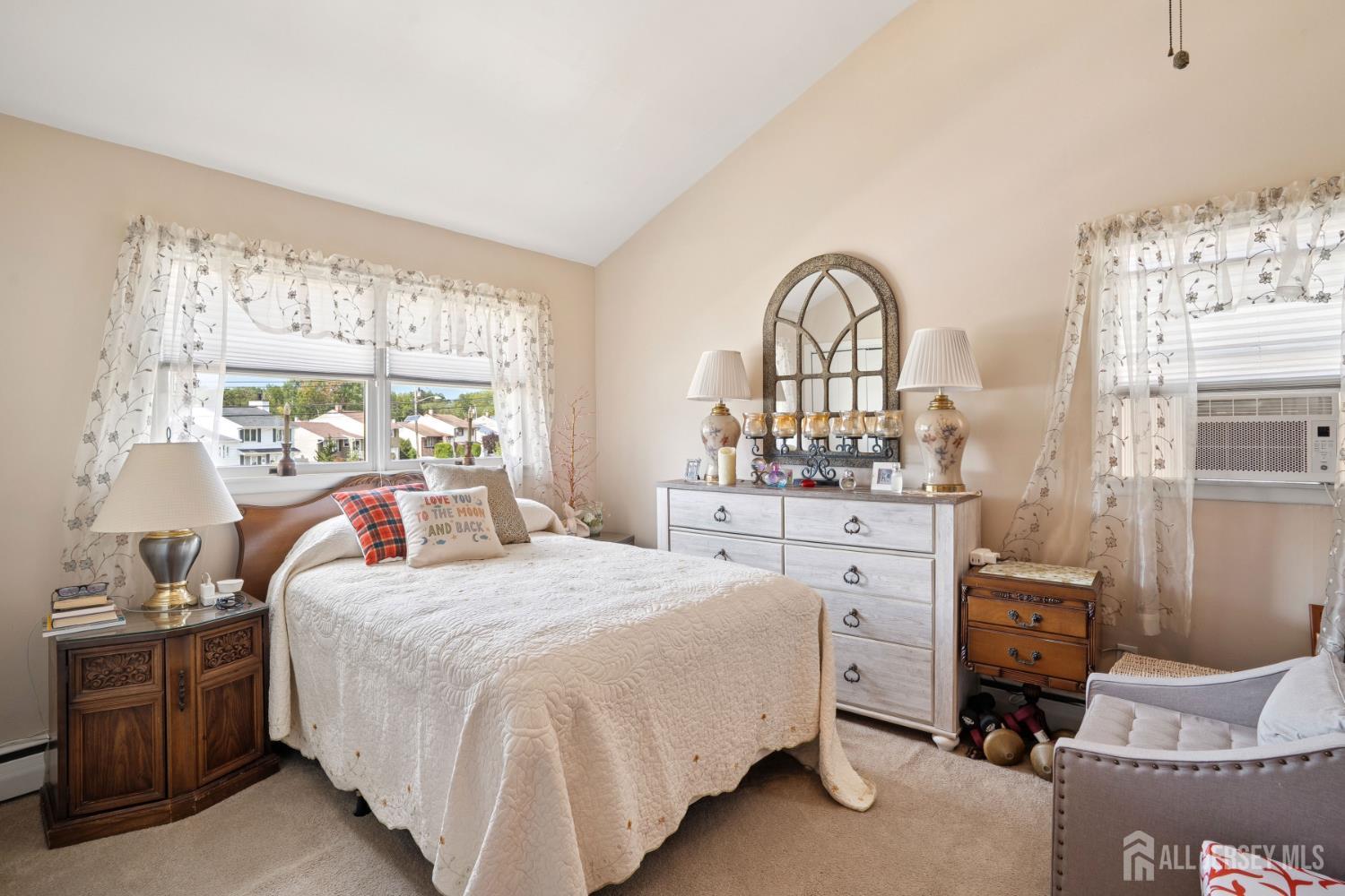 266 Amherst Avenue Colonia, NJ 07067 - Photo 8 of 22 a bedroom with a bed and a large window