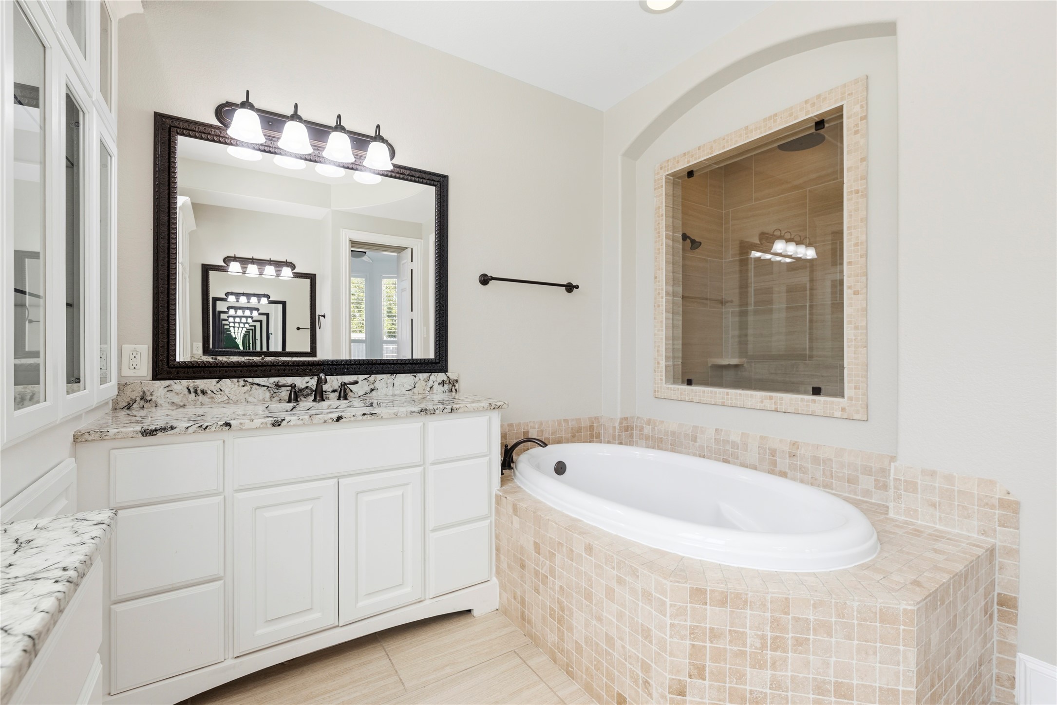 28226 South Firethorne Road Katy, TX 77494 - Photo 17 of 39 Indulge in total relaxation in the deep jetted tub, beautifully encased in custom tile work and perfectly positioned next to a designer vanity area.