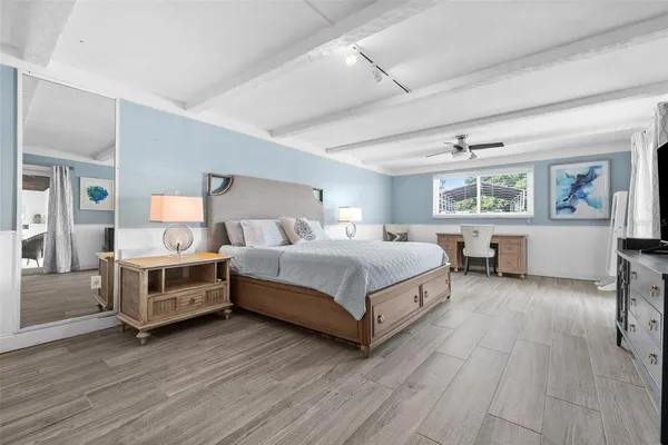 a bedroom with a bed and a window