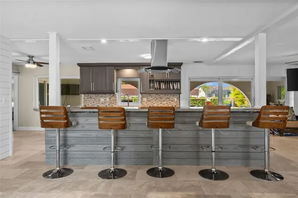 a kitchen with stainless steel appliances granite countertop a stove and cabinets