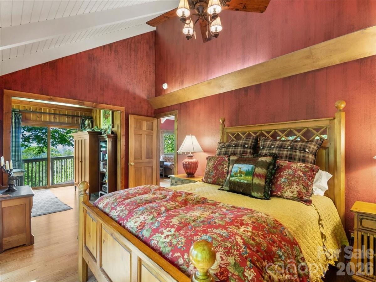 121 Ivy Ridge Road Burnsville, NC 28714 - Photo 20 of 48 a bedroom with a large bed and a large window