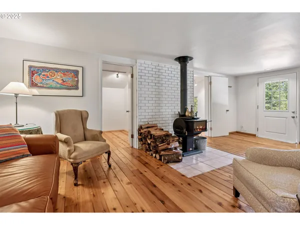 a living room with furniture and a lamp