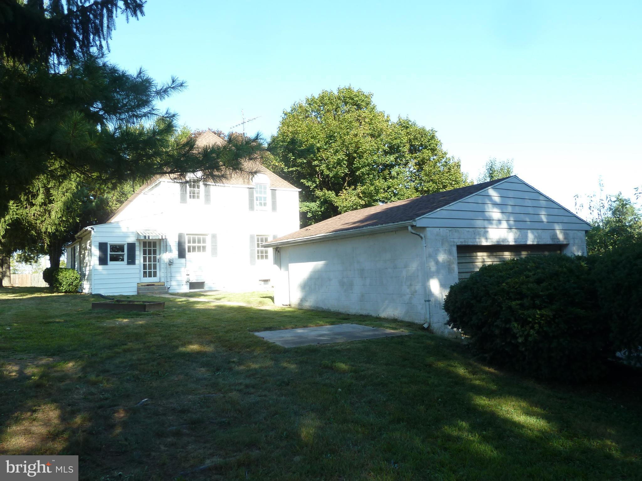 874-884 Delta Road Red Lion, PA 17356 - Photo 11 of 27 a view of a yard in front of a house with plants and large tree