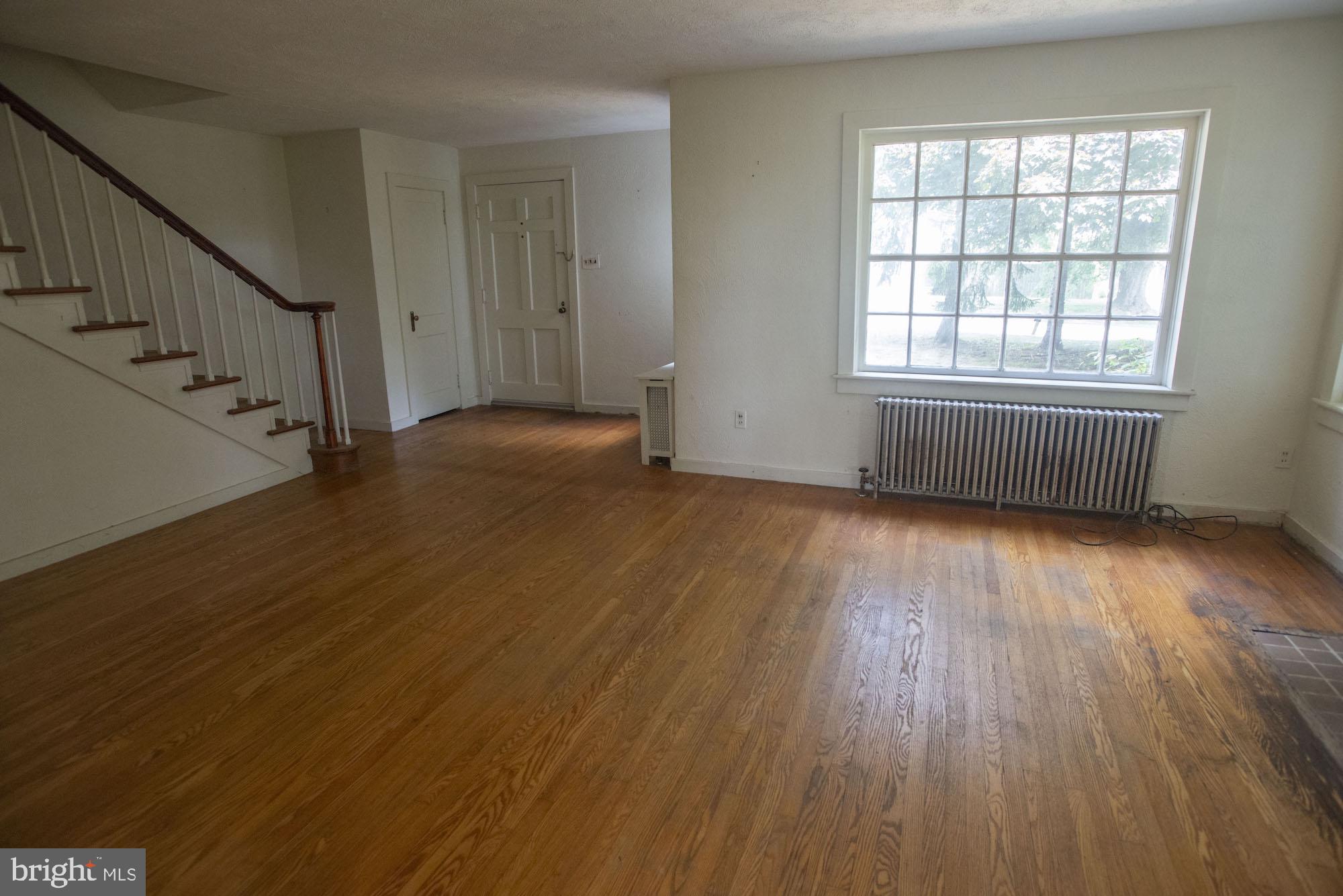 874-884 Delta Road Red Lion, PA 17356 - Photo 14 of 27 a view of an empty room with wooden floor and windows