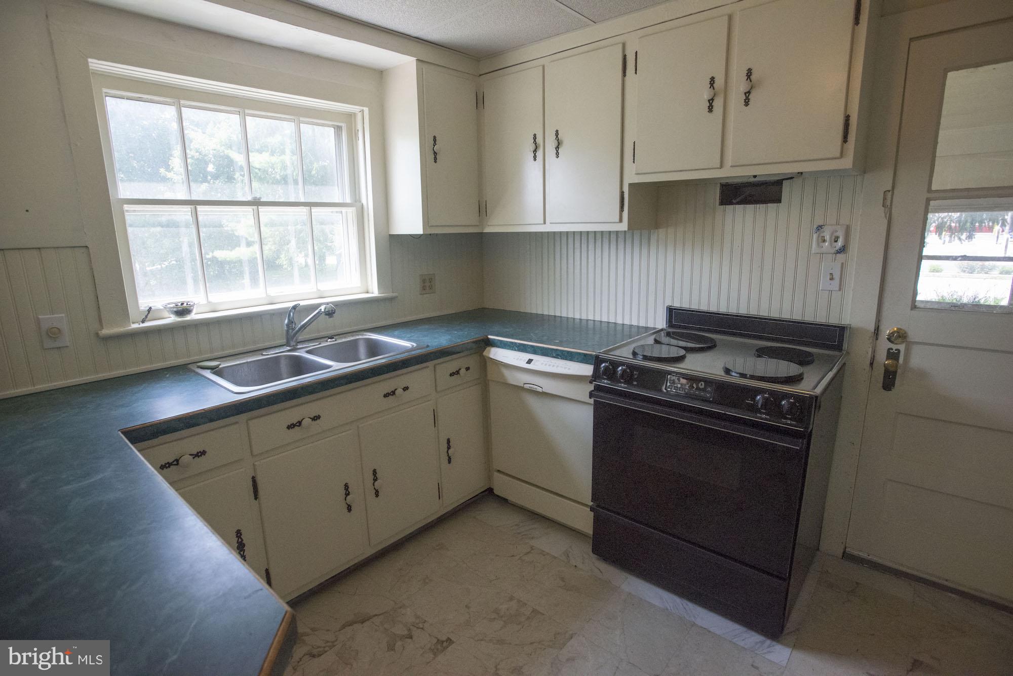 874-884 Delta Road Red Lion, PA 17356 - Photo 16 of 27 a kitchen with stainless steel appliances granite countertop a sink stove and refrigerator