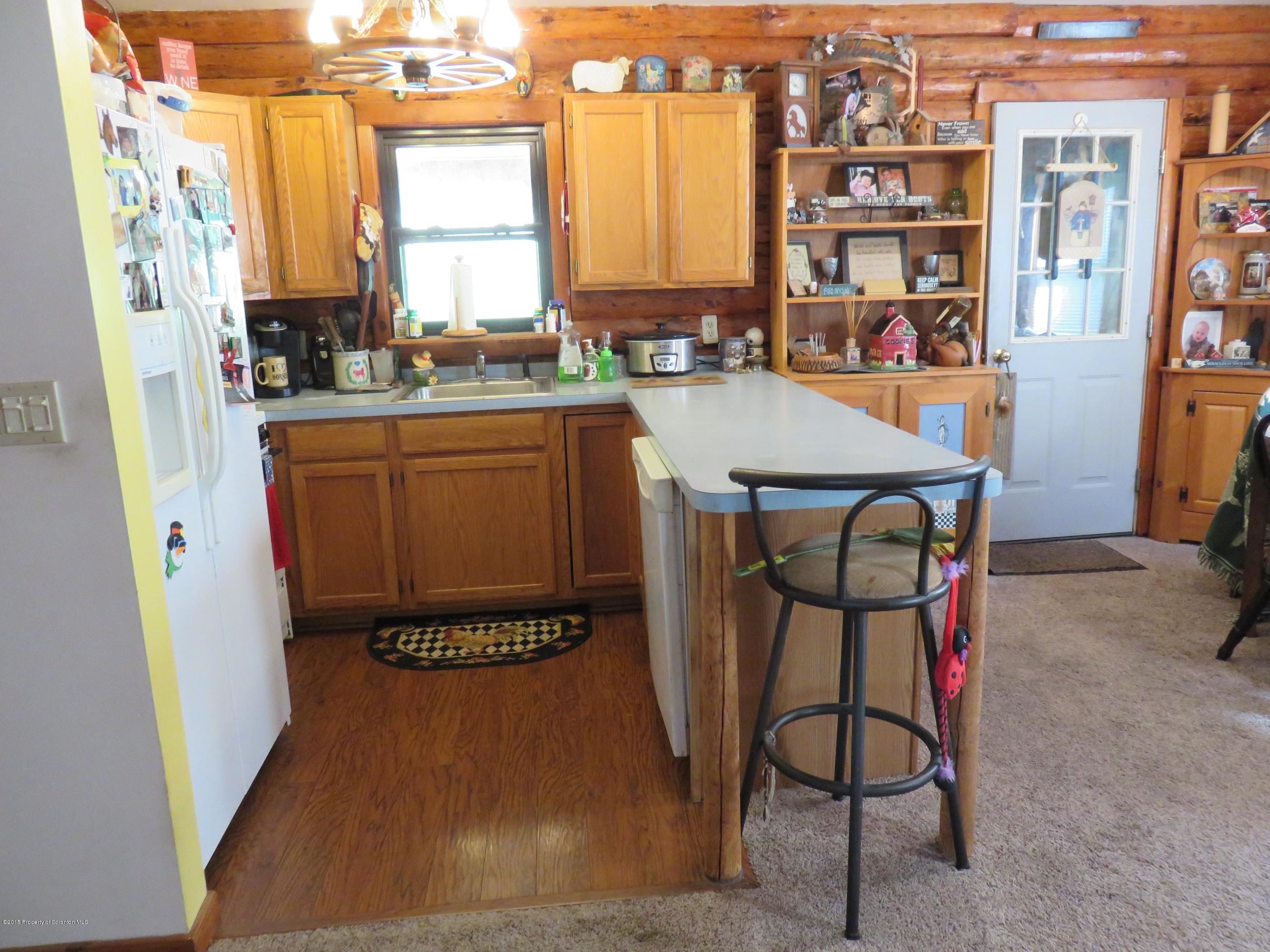 138 Spring Hill Road Moscow, PA 18444 - Photo 5 of 30 a dining room with furniture and a window