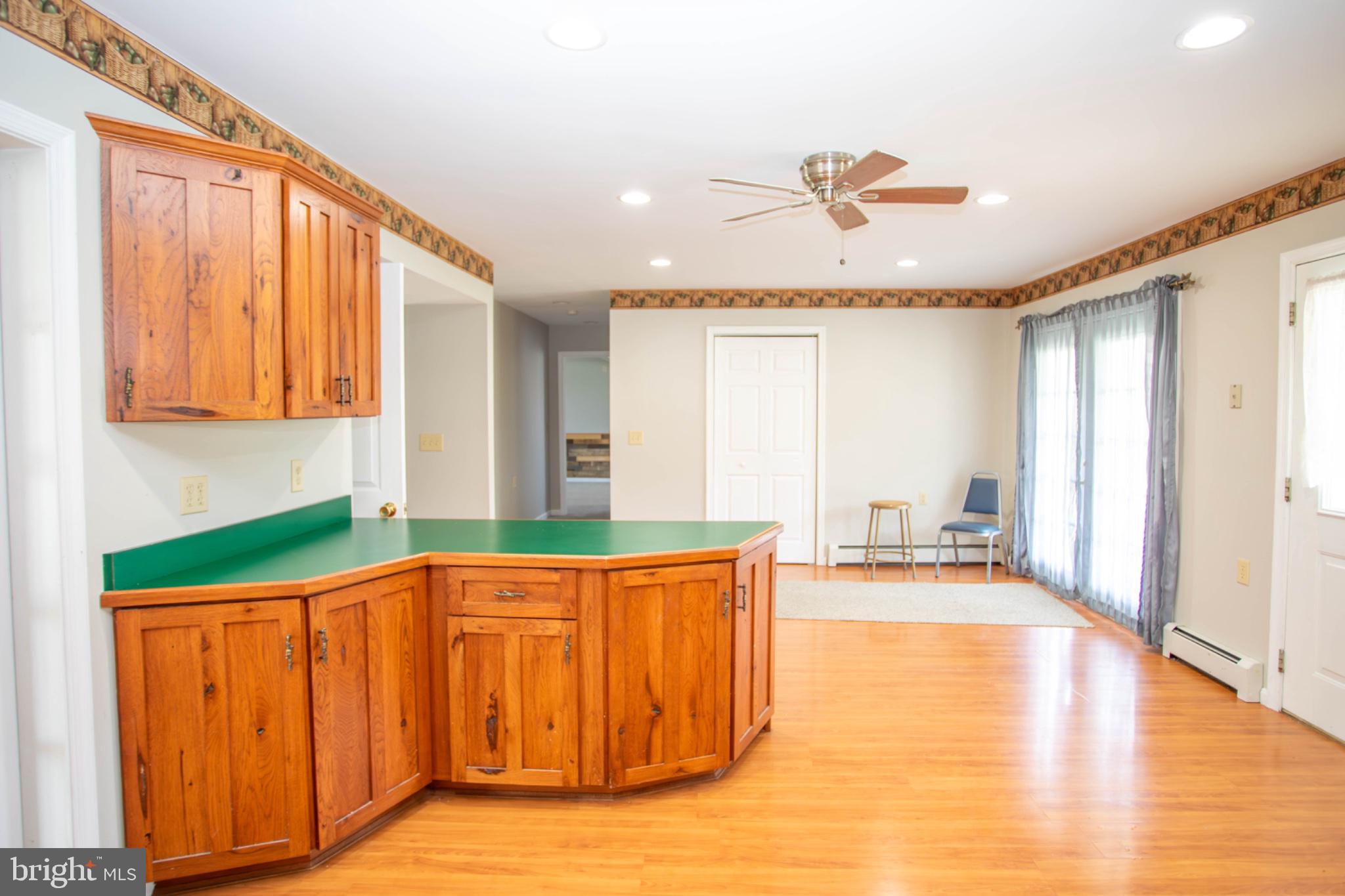 161 Coyote Run Mathias, WV 26812 - Photo 22 of 88 Inviting open space with warm wood accents.
