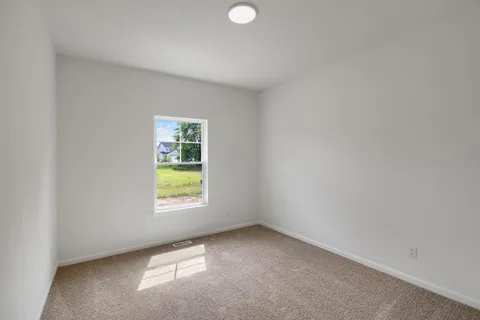 a view of a window in an empty room