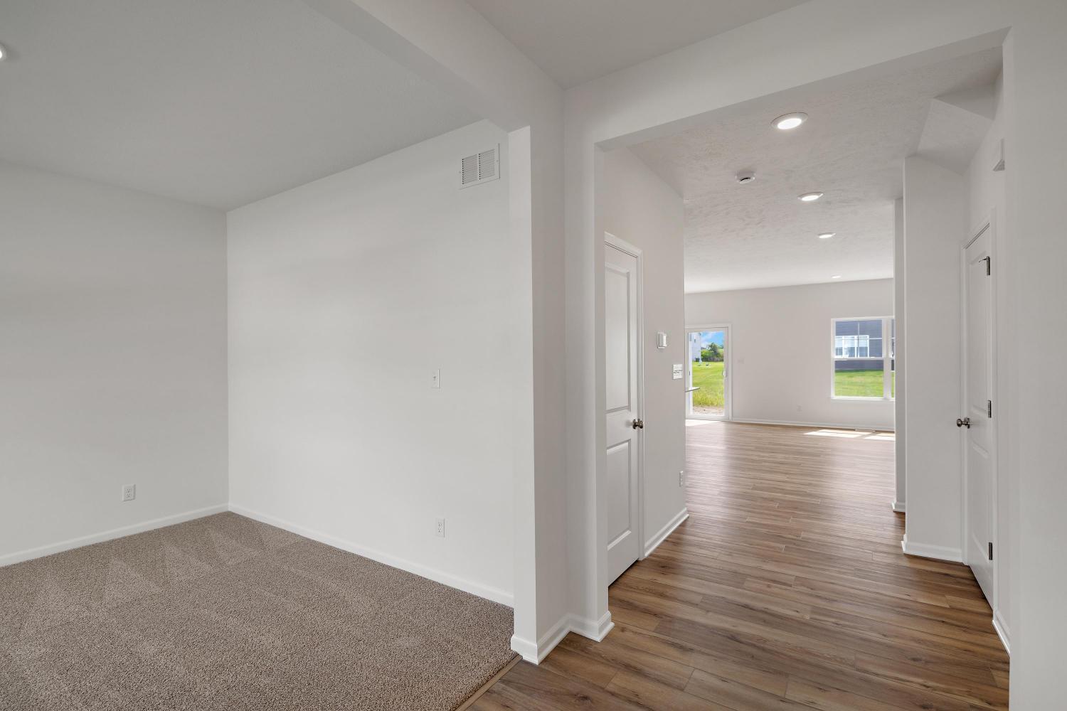 557 East 130th Lane Crown Point, IN 46307 - Photo 3 of 23 a view of a hallway with wooden floor