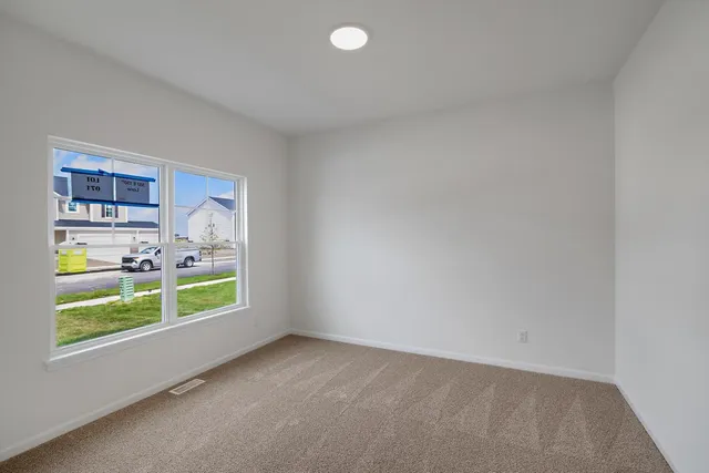 a view of workspace with furniture and window