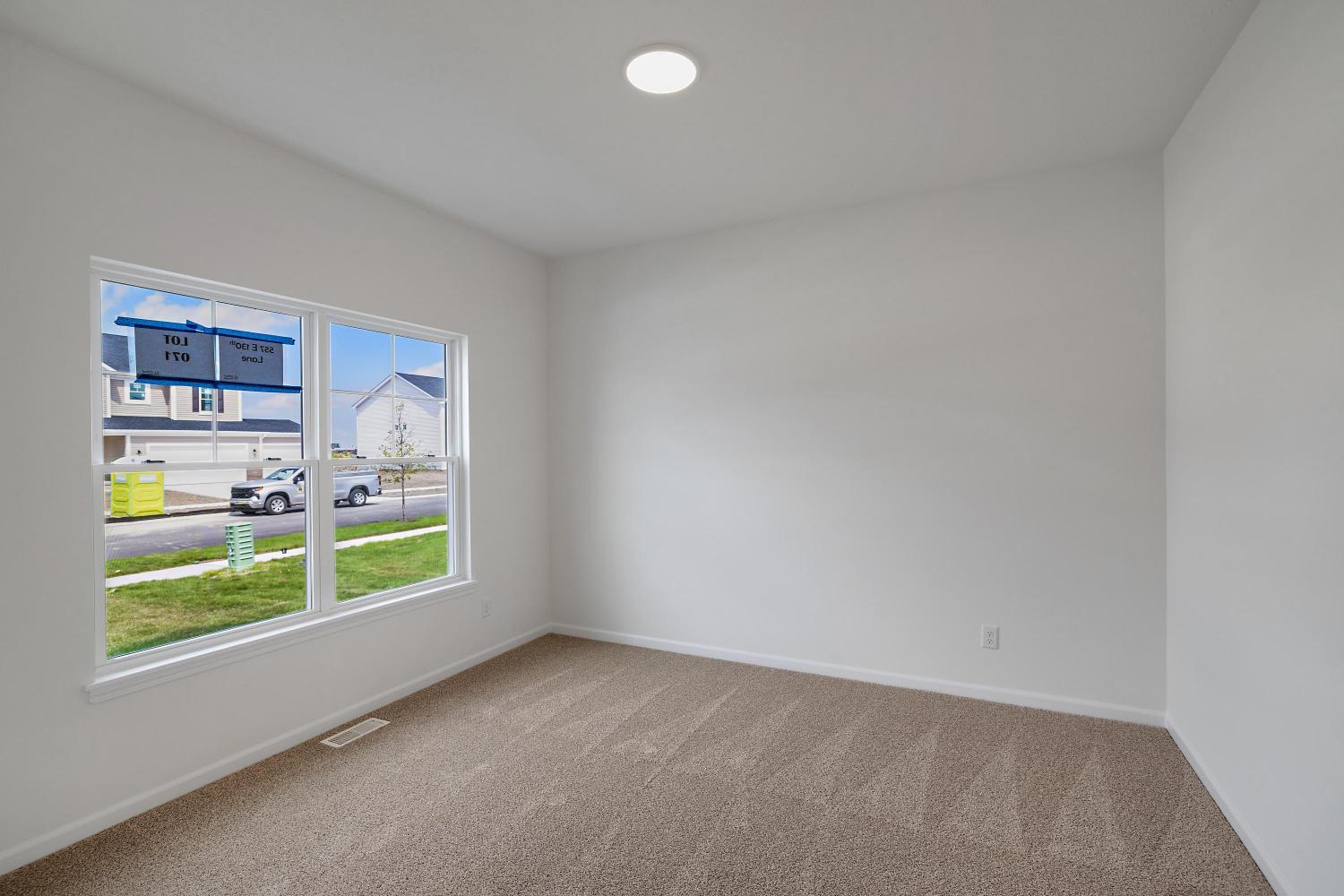 557 East 130th Lane Crown Point, IN 46307 - Photo 4 of 23 a view of workspace with furniture and window