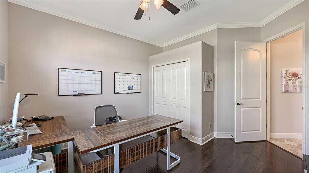 15425 Mulholland Road Parrish, FL 34219 - Photo 16 of 67 a view of a workspace with furniture and wooden floor