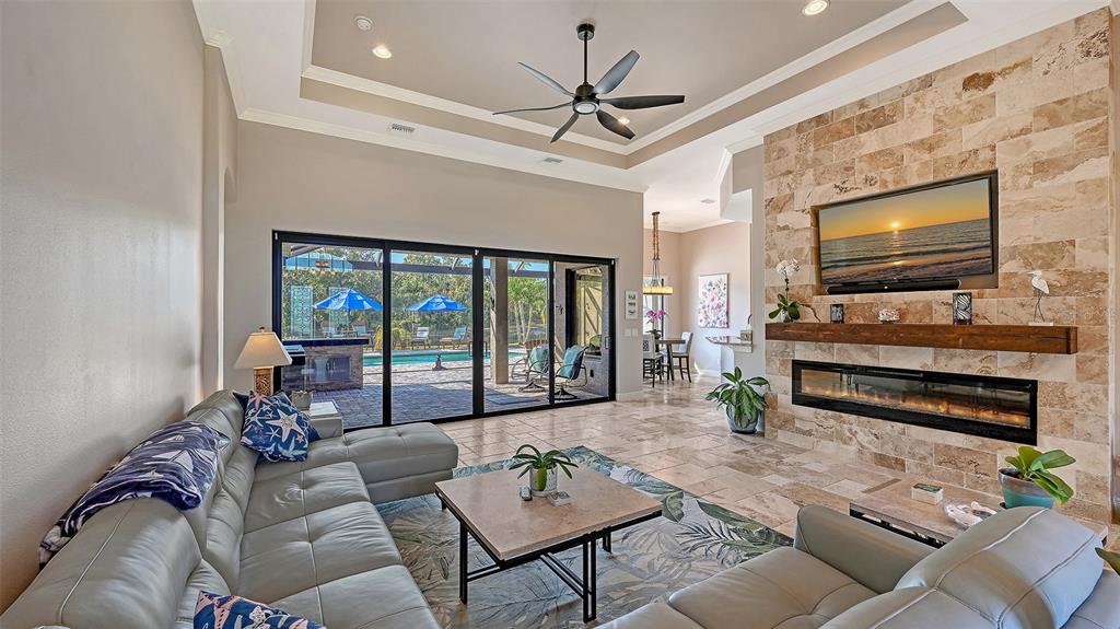 15425 Mulholland Road Parrish, FL 34219 - Photo 20 of 67 a living room with furniture and a flat screen tv