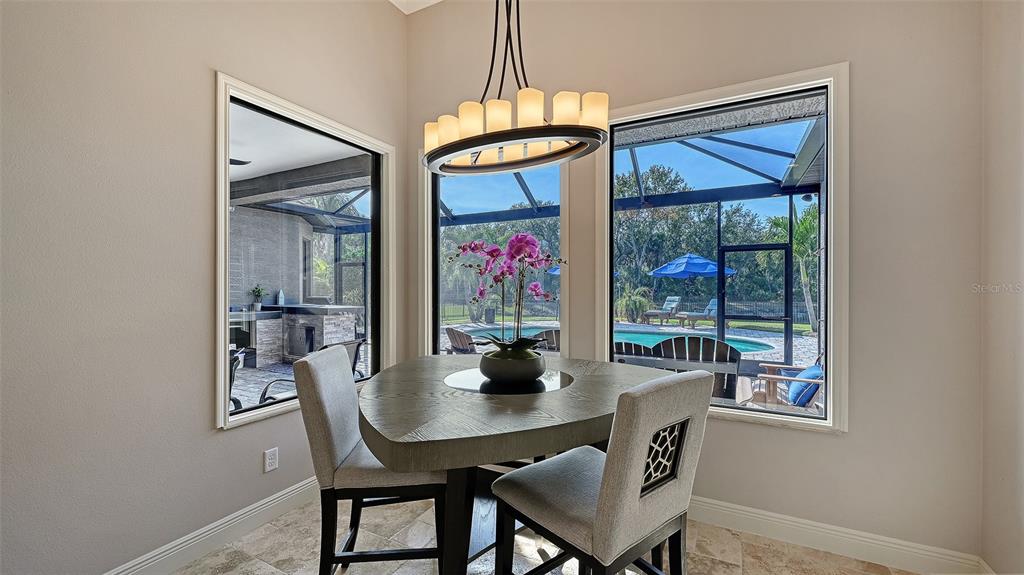 15425 Mulholland Road Parrish, FL 34219 - Photo 28 of 67 a view of a dining room with furniture wooden floor and window