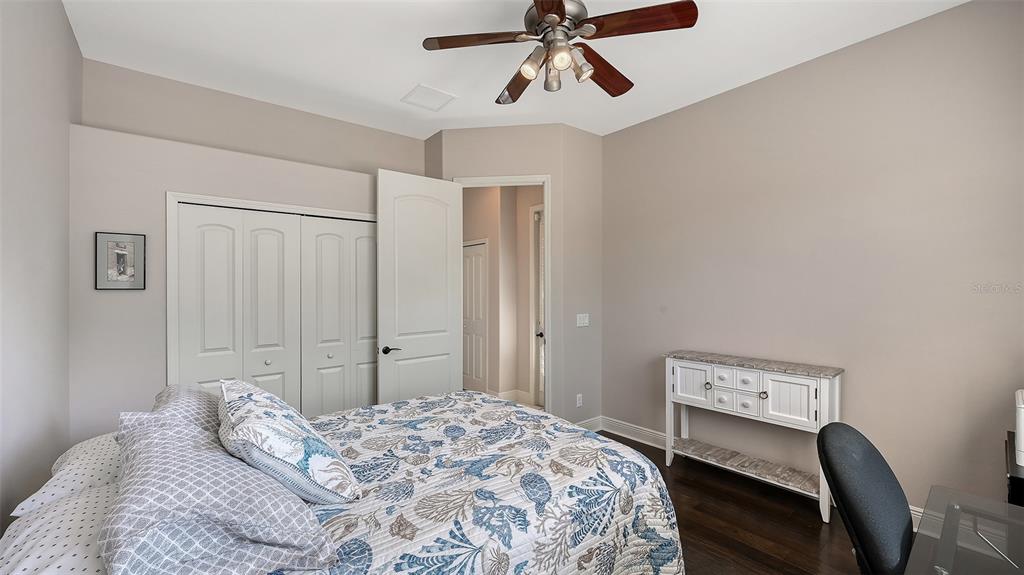 15425 Mulholland Road Parrish, FL 34219 - Photo 31 of 67 a bedroom with a bed and a dresser