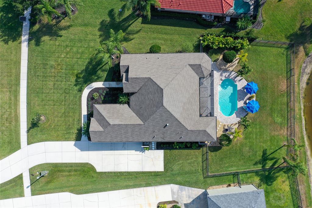 15425 Mulholland Road Parrish, FL 34219 - Photo 4 of 67 an aerial view of a house with a yard