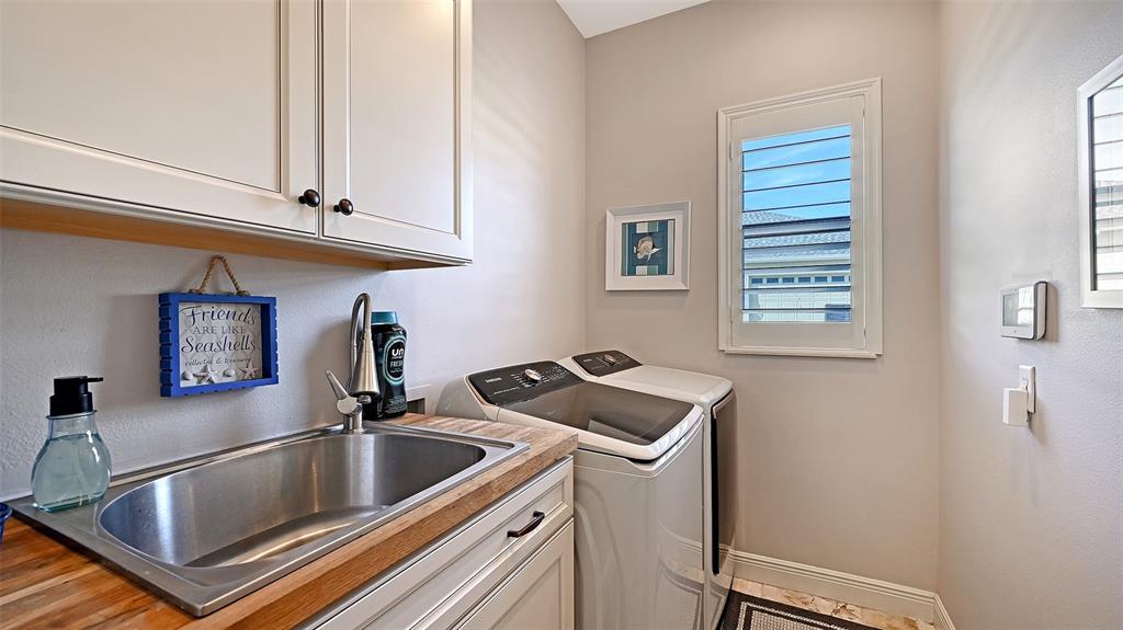 15425 Mulholland Road Parrish, FL 34219 - Photo 41 of 67 a kitchen with a sink cabinets and a window