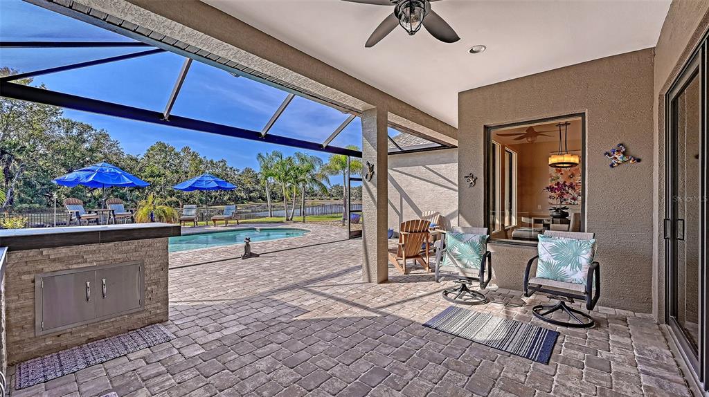 15425 Mulholland Road Parrish, FL 34219 - Photo 43 of 67 a view of a chairs and tables in patio