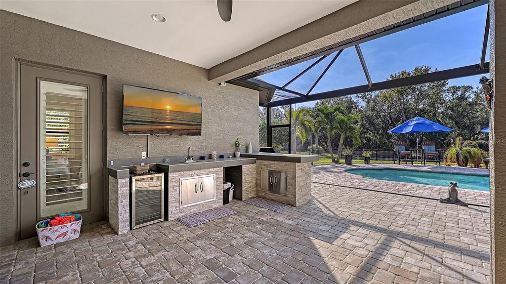 15425 Mulholland Road Parrish, FL 34219 - Photo 44 of 67 a kitchen with stainless steel appliances granite countertop a sink and cabinets