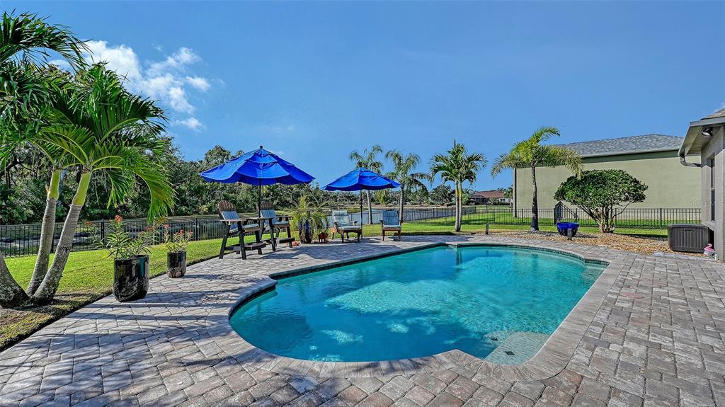 15425 Mulholland Road Parrish, FL 34219 - Photo 49 of 67 a swimming pool with outdoor seating