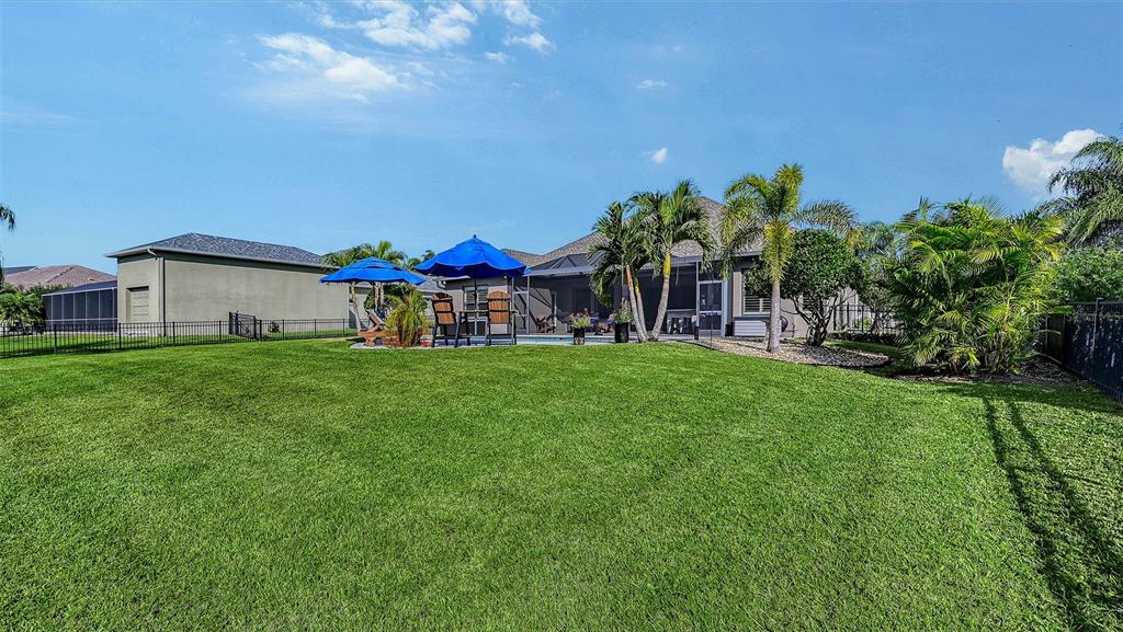 15425 Mulholland Road Parrish, FL 34219 - Photo 52 of 67 a front view of a house with garden