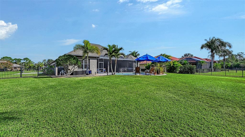 15425 Mulholland Road Parrish, FL 34219 - Photo 53 of 67 a view of house with garden space and trees