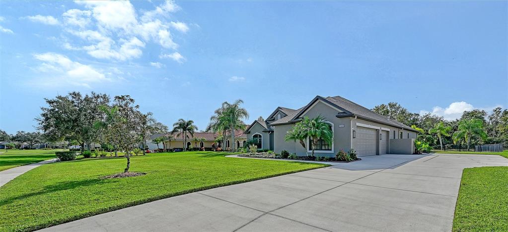 15425 Mulholland Road Parrish, FL 34219 - Photo 56 of 67 a view of a house with a yard