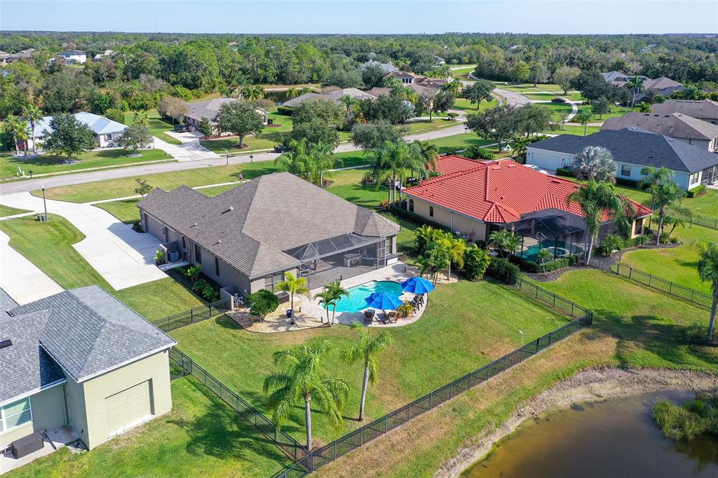 15425 Mulholland Road Parrish, FL 34219 - Photo 6 of 67 an aerial view of a house with garden space and lake view